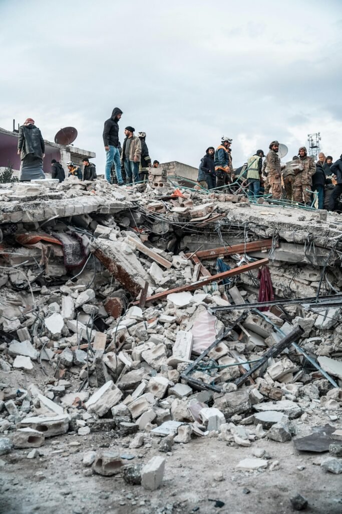 People inspect rubble after an earthquake in Jindires, Aleppo Governorate, Syria.|| iran eathquake thumbnail for website